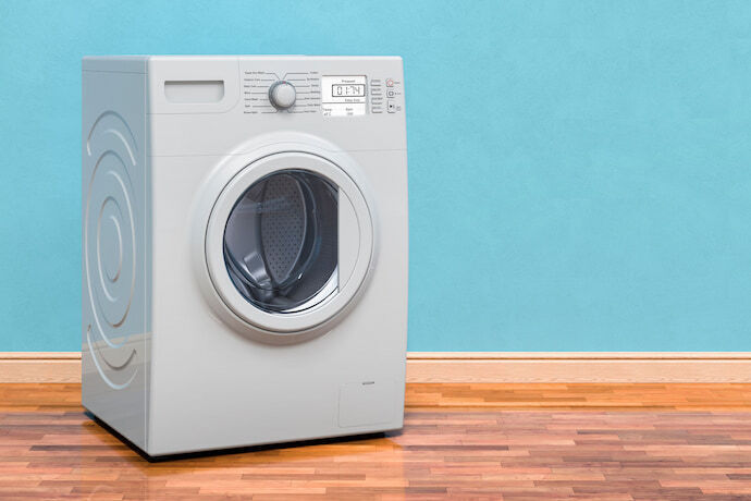 máquina de lavar roupa com fundo azul