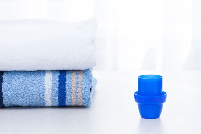 toalhas e tampa de sabao liquido